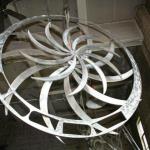  Le relax a la turbine 
Sculpture réalisé par Denis Poirier et Hans Barzeele, 2005-2007.
Acier Inoxydable, 
Ensemble en trois partie, chaise qui n’est pas une chaise et d’une table qui n’est pas une table, agencer d’une roue suspendu, la turbine. 
15000$
