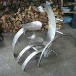 Le relax a la turbine 
Sculpture réalisé par Denis Poirier , 2005-2007.
Acier Inoxydable, 
Ensemble en trois partie, chaise qui n’est pas une chaise et d’une table qui n’est pas une table, agencer d’une roue suspendu, la turbine. 
15000$
